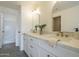 Bright bathroom featuring a dual sink vanity and shower/tub combo at 507 W Magdalena Ln, Phoenix, AZ 85041