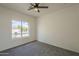 This bright bedroom has a window with views of the property at 507 W Magdalena Ln, Phoenix, AZ 85041