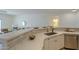 Kitchen features white quartz counters, subway tile backsplash, and stainless steel appliances at 507 W Magdalena Ln, Phoenix, AZ 85041