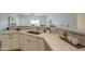 This kitchen features white cabinets, quartz countertops, and a stainless steel dishwasher at 507 W Magdalena Ln, Phoenix, AZ 85041