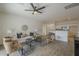 Bright, neutral living room with tile floors, a ceiling fan, and an open layout at 507 W Magdalena Ln, Phoenix, AZ 85041