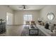 Bright living room with tile flooring, a comfortable sofa, decorative rug, and backyard access at 507 W Magdalena Ln, Phoenix, AZ 85041