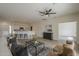 Bright living area with tile flooring, an area rug and a view into kitchen at 507 W Magdalena Ln, Phoenix, AZ 85041