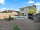 Backyard featuring a pool, desert landscaping, and an outdoor barbecue area perfect for entertaining at 5110 E Peak View Rd, Cave Creek, AZ 85331