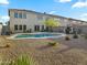Backyard featuring a pool, desert landscaping, and home exterior with large windows at 5110 E Peak View Rd, Cave Creek, AZ 85331