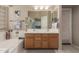 Bright bathroom features a bathtub, double sinks, and neutral color scheme at 5432 N Ormondo Way, Litchfield Park, AZ 85340