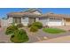 Single-story home with desert landscaping and a two car garage at 5432 N Ormondo Way, Litchfield Park, AZ 85340
