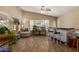 Relaxing room features large windows, a bar area, and stylish seating at 5432 N Ormondo Way, Litchfield Park, AZ 85340