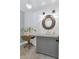 Elegant powder room with wood accents, classic vanity, and decorative lighting at 6102 E Calle Del Norte --, Scottsdale, AZ 85251