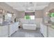 Spacious bathroom featuring double vanities, freestanding tub, and elegant lighting fixtures at 6102 E Calle Del Norte --, Scottsdale, AZ 85251