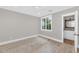 Bright bedroom features light hardwood floors, large window, and gray walls at 6102 E Calle Del Norte --, Scottsdale, AZ 85251
