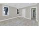 Bright bedroom features light hardwood floors, large window, and gray walls at 6102 E Calle Del Norte --, Scottsdale, AZ 85251
