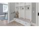 Inviting entryway with built-in storage, bench seating, and view to the living room at 6102 E Calle Del Norte --, Scottsdale, AZ 85251