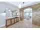 Stylish entryway with brick archway, decorative mirror, and hardwood floors at 6102 E Calle Del Norte --, Scottsdale, AZ 85251