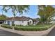 Angle view of the property showcasing brick perimeter, lawn and beautiful landscaping at 6102 E Calle Del Norte --, Scottsdale, AZ 85251