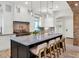Kitchen features a large island with bar seating, modern lighting, and a full range of stainless appliances at 6102 E Calle Del Norte --, Scottsdale, AZ 85251