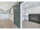 Modern laundry room with black washer and dryer, custom cabinets, and tile floors at 6102 E Calle Del Norte --, Scottsdale, AZ 85251