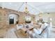 Spacious living room with wood floors, vaulted ceilings, exposed beams, and an open floor plan at 6102 E Calle Del Norte --, Scottsdale, AZ 85251