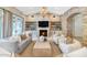 Inviting living room features a fireplace with a brick surround, built-in shelving, and comfortable seating at 6102 E Calle Del Norte --, Scottsdale, AZ 85251