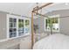 Bright bedroom boasts wood beam decor and french doors with backyard pool view at 6102 E Calle Del Norte --, Scottsdale, AZ 85251