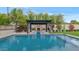 Serene outdoor setting featuring a pool, a fire pit, and landscaped borders creating a private retreat at 6102 E Calle Del Norte --, Scottsdale, AZ 85251