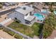 Aerial view of backyard with refreshing pool, well-kept lawn and shaded patio, perfect for outdoor living at 6237 W Altadena Ave, Glendale, AZ 85304