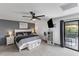 Spacious bedroom with balcony access, featuring a ceiling fan and neutral decor at 6237 W Altadena Ave, Glendale, AZ 85304