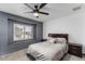 Cozy bedroom with a ceiling fan, plush carpet, a window, and nice furniture at 6237 W Altadena Ave, Glendale, AZ 85304