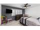 Comfortable bedroom with neutral tones, a ceiling fan, a window with blinds, and carpet flooring at 6237 W Altadena Ave, Glendale, AZ 85304