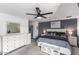 Well-lit bedroom with modern ceiling fan, with modern furniture and neutral color scheme at 6237 W Altadena Ave, Glendale, AZ 85304