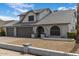 Charming home featuring a well-maintained front yard with grey paint and a two car garage at 6237 W Altadena Ave, Glendale, AZ 85304