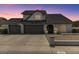 Charming single-Gathering home featuring a three-car garage and well-maintained front yard at 6237 W Altadena Ave, Glendale, AZ 85304