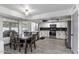 Modern kitchen with stainless steel appliances, tile floors, and white cabinetry at 6237 W Altadena Ave, Glendale, AZ 85304
