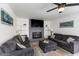 Inviting living room with a cozy fireplace and comfortable seating, perfect for relaxation at 6237 W Altadena Ave, Glendale, AZ 85304