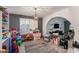 Spacious playroom with ample storage, toys, and an open layout to the adjacent living area at 6237 W Altadena Ave, Glendale, AZ 85304