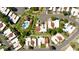 Aerial view of a community showcasing well-maintained homes, green spaces, mature trees, and a swimming pool at 6252 E Aire Libre Ln, Scottsdale, AZ 85254