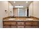 Bathroom featuring double sinks, updated fixtures, and neutral colors at 6252 E Aire Libre Ln, Scottsdale, AZ 85254