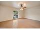 Bright bedroom has tile floors and a contemporary ceiling fan at 6252 E Aire Libre Ln, Scottsdale, AZ 85254