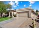 Modern home with a two-car garage and desert landscaping at 6252 E Aire Libre Ln, Scottsdale, AZ 85254