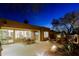 Cozy backyard with a patio dining set and outdoor seating area, ideal for entertaining at 6936 E Whispering Mesquite Trl, Scottsdale, AZ 85266