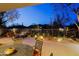 Backyard patio offers ample seating, desert landscaping, and an outdoor grill; perfect for entertaining at 6936 E Whispering Mesquite Trl, Scottsdale, AZ 85266