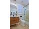 Stylish bathroom highlighting a contemporary vanity, unique mirror, and a walk-in shower with elegant tile work at 6936 E Whispering Mesquite Trl, Scottsdale, AZ 85266