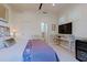 Bright primary bedroom with comfortable bed, stylish decor, and a beverage cooler for ultimate relaxation and convenience at 6936 E Whispering Mesquite Trl, Scottsdale, AZ 85266