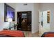 Bedroom closet featuring custom shelving, drawers, and hanging rods, offering ample and organized storage space at 6936 E Whispering Mesquite Trl, Scottsdale, AZ 85266