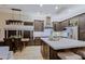 Spacious kitchen featuring a large island, stainless steel appliances, and a cozy breakfast nook at 6936 E Whispering Mesquite Trl, Scottsdale, AZ 85266