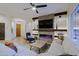 Cozy living room featuring a modern electric fireplace and stylish furnishings for comfort at 6936 E Whispering Mesquite Trl, Scottsdale, AZ 85266