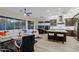 Bright and open living room flowing into the kitchen with modern design and ample seating at 6936 E Whispering Mesquite Trl, Scottsdale, AZ 85266