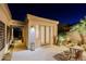 Charming patio area with stone flooring, outdoor seating, and tasteful landscaping, creating a tranquil retreat at 6936 E Whispering Mesquite Trl, Scottsdale, AZ 85266