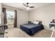 Neutral bedroom featuring a queen-sized bed, a ceiling fan, and a window view at 806 W El Alba Way, Chandler, AZ 85225