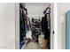 Organized walk-in closet featuring shoe racks and storage for clothes and accessories at 806 W El Alba Way, Chandler, AZ 85225